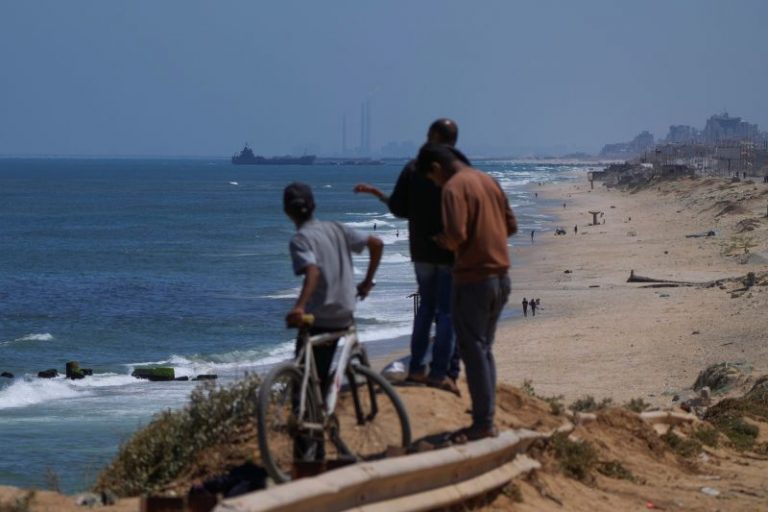 US military starts delivering aid to Gaza through floating pier. Here’s what we know